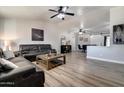 Spacious living room with vaulted ceiling, ceiling fans, and recessed lighting at 4026 N 81St St, Scottsdale, AZ 85251