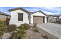 A charming single-story home with desert landscaping and a two-car garage at 40440 W Haley Dr, Maricopa, AZ 85138