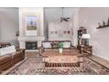 Inviting living room featuring a fireplace, high ceilings, and tile flooring at 6118 E Star Valley St, Mesa, AZ 85215