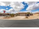 Corner lot home with a manicured yard and desert landscaping in a quiet neighborhood at 6634 S Pinnacle Ct, Chandler, AZ 85249