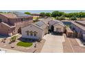 Single-story stucco home with solar panels in a well-maintained neighborhood at 6915 S Sapphire Way, Chandler, AZ 85249