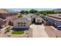 Beautiful single-story home showcasing desert landscaping and solar panels at 6915 S Sapphire Way, Chandler, AZ 85249