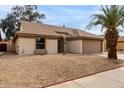 Well-maintained home with low-maintenance desert landscaping and a cozy, inviting facade at 10135 W Orange Dr, Glendale, AZ 85307