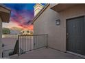 Condo front door with a smart lock, porch, and exterior light at 16013 S Desert Foothills Pkwy # 2089, Phoenix, AZ 85048
