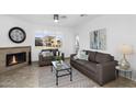 Cozy living room with fireplace, ceiling fan and mountain views at 16013 S Desert Foothills Pkwy # 2089, Phoenix, AZ 85048