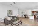 Open concept living room leading into a dining area and kitchen at 16013 S Desert Foothills Pkwy # 2089, Phoenix, AZ 85048