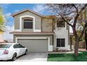 Two-story home with a two-car garage, neutral paint scheme, lawn, and mature trees at 1635 W Dunbar Dr, Phoenix, AZ 85041