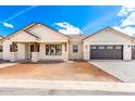 Charming single-Gathering home featuring a neutral color palette, desert landscaping, and a two-car garage at 1645 E Minton St, Mesa, AZ 85203