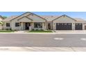 Attractive single-Gathering home featuring stone veneer and a three-car garage at 1645 E Minton St, Mesa, AZ 85203
