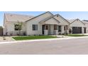 Desirable single-level home featuring a covered entry and an attached two-car garage at 1645 E Minton St, Mesa, AZ 85203
