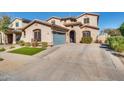 Beautiful house showcasing a well-kept lawn and a two-car garage at 16532 W Rowel Rd, Surprise, AZ 85387