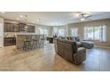 Spacious open floor plan connecting the living room, kitchen, and dining area at 16830 W Magnolia St, Goodyear, AZ 85338