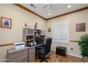 Home office with wood flooring, a built-in desk, and bright natural light at 19140 N Tamarisk Flower Way, Surprise, AZ 85387