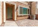 Welcome home to this residence featuring a covered front porch with neutral toned facade at 2632 S Peppertree Dr # 104, Gilbert, AZ 85295