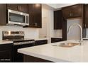 Up close view of stainless steel appliances and quartz countertops at 2663 S Equestrian Dr # 106, Gilbert, AZ 85295