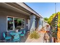 Inviting front porch with a cozy seating area, offering a perfect spot for relaxation at 340 E Harwell Rd, Gilbert, AZ 85234