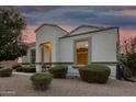 Inviting front entrance, complemented by lovely landscaping, and neutral stucco at 36070 N Quiros Dr, San Tan Valley, AZ 85143