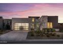Stunning contemporary home showcasing clean lines, mixed materials, and a stylish garage door at 37200 N Cave Creek Rd # 1035, Scottsdale, AZ 85262