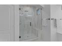 Modern bathroom featuring a glass-enclosed shower with a built-in bench and tiled walls at 3777 E Latham Ct, Gilbert, AZ 85297