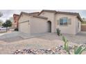 Single-Gathering home with a two-car garage and low-maintenance desert landscaping at 44125 W Cydnee Dr, Maricopa, AZ 85138