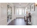Inviting entryway with hardwood floors, decorative table, and stylish wall decor at 4639 E Mulberry Dr, Phoenix, AZ 85018