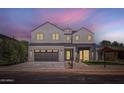 Stunning two-story home featuring a modern design, multi-car garage, and neatly landscaped front yard at 4640 E Glenrosa Ave, Phoenix, AZ 85018