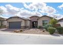 Charming one-story home with desert landscaping, a two-car garage, and a welcoming entrance at 5723 E Jake Hvn, Cave Creek, AZ 85331