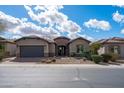 Charming single-story home with a desert-landscaped front yard and a spacious two-car garage at 5723 E Jake Hvn, Cave Creek, AZ 85331