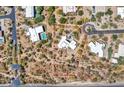Overhead view of desert home with pool on a large private lot outlined in red at 5805 E Agave Pl, Carefree, AZ 85377