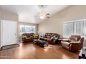 Bright living room featuring high ceilings, hardwood floors, and large windows for ample natural light at 8947 W Sierra Vista Dr, Glendale, AZ 85305