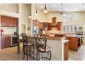 Well-equipped kitchen with granite countertops, custom cabinets, and stainless steel appliances at 8960 W Kerry Ln, Peoria, AZ 85382