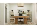 Stylish home office features a large desk and shelving for organization at 12219 E Sunflower Ln, Florence, AZ 85132