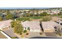 Birds eye view of home, showcasing desert landscaping, tile roof, and proximity to a golf course at 1240 E Friess Dr, Phoenix, AZ 85022