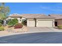 Attractive home with a spacious two-car garage, desert landscaping, and a well-maintained tile roof at 1240 E Friess Dr, Phoenix, AZ 85022