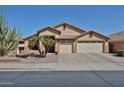 Inviting single-story home featuring a three-car garage and desert landscaping with a mature cactus and palm trees at 12814 W Windrose Dr, El Mirage, AZ 85335