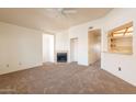 Inviting living room features a fireplace and an open layout to the kitchen at 1331 W Baseline Rd # 340, Mesa, AZ 85202