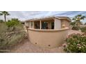 Comfortable backyard patio shaded by an awning, with seating options for relaxing outdoors at 17335 W Gould Mine Ln, Surprise, AZ 85387