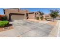 Long driveway to the garage, landscaped for privacy at 22624 S 224Th Pl, Queen Creek, AZ 85142