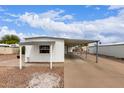 Charming home with a low maintenance desert rock yard and covered carport at 241 S 54Th St, Mesa, AZ 85206