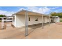 Side view of a well maintained home featuring a convenient covered carport at 241 S 54Th St, Mesa, AZ 85206