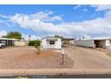 Charming home with a low maintenance desert rock yard and covered carport at 241 S 54Th St, Mesa, AZ 85206