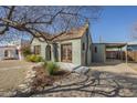 Side view showing a charming home with unique architectural details, porte cochere, and inviting curb appeal at 2538 N 8Th St, Phoenix, AZ 85006