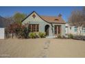 Charming vintage home with arched entry, original windows, and xeriscaped front yard at 2538 N 8Th St, Phoenix, AZ 85006