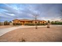 Charming home with a circular driveway, mature landscaping, and inviting front porch, perfect for enjoying the outdoors at 25903 S Lemon Ave, Queen Creek, AZ 85142