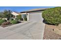 Well-kept house featuring a clean driveway and manicured landscaping at 27138 W Escuda Dr, Buckeye, AZ 85396