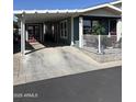 Exterior view of a well-kept single-Gathering home featuring a covered carport at 3504 N Hawes Rd # 3504, Mesa, AZ 85207