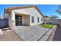 Private backyard featuring a brick paver patio, low maintenance turf, and low maintenance gravel at 4135 E Cathy Dr, Gilbert, AZ 85296