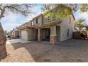 Beautiful home featuring a two-car garage, inviting entrance, and low-maintenance desert yard at 44961 W Miraflores St, Maricopa, AZ 85139