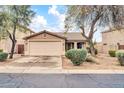 Charming single-story home featuring a two-car garage and desert landscaping at 4533 E Coyote Wash Dr, Cave Creek, AZ 85331