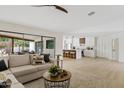 Open-concept living room and kitchen with hardwood floors and modern design at 5819 E Ludlow Dr, Scottsdale, AZ 85254